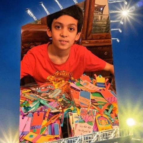 A student with his bookmark fundraiser for street children